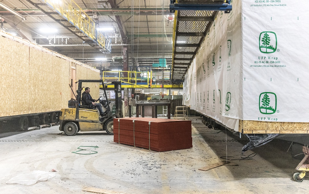 a manufactured home being constructed in a controlled indoor building facility